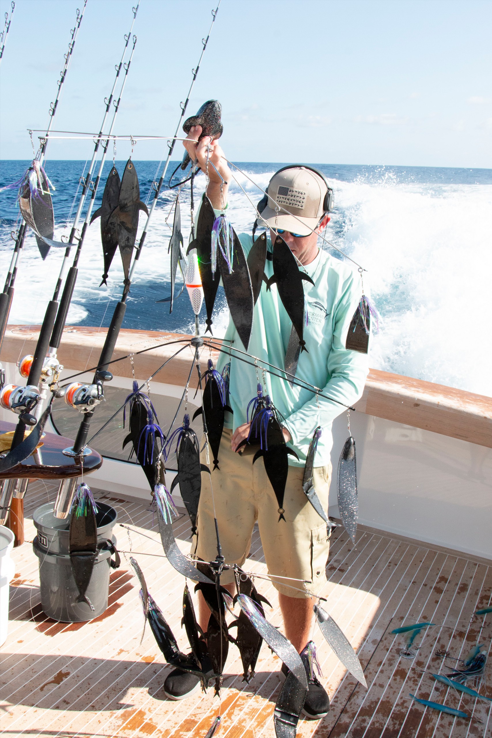 mud flap dredge being lifted on the back deck of the boat