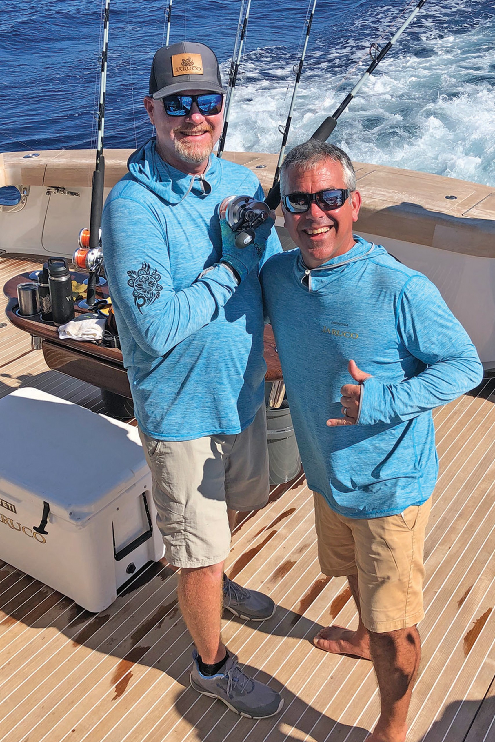 Dale Wills and John Riggs on back of Jaruco for a picture