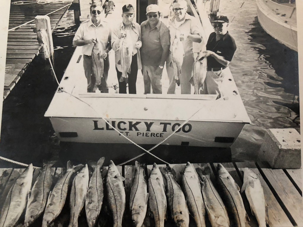 Captain Sam Crutchfield more fish behind his boat