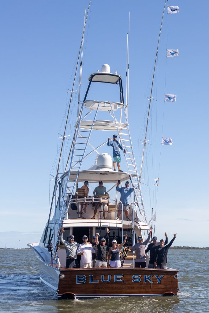 The crew of the Blue Sky posing onboard on all decks.