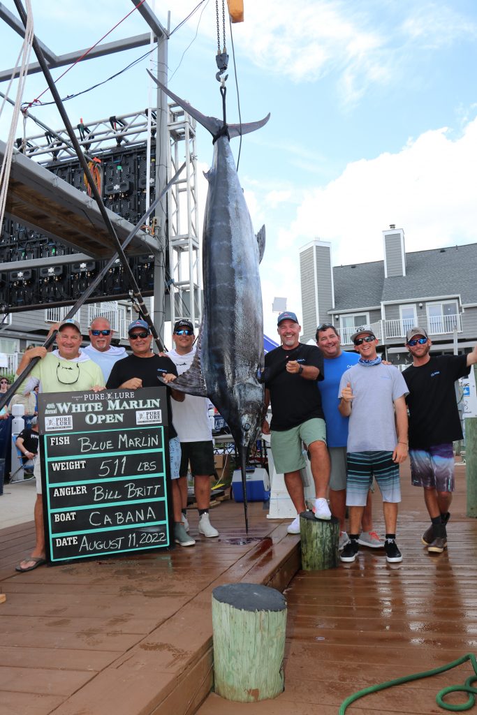 The crew of the Billfisher posing with their blue marlin